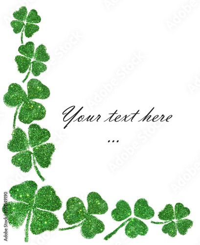 Composition with abstract leaves of clover of green glitter with place for your text