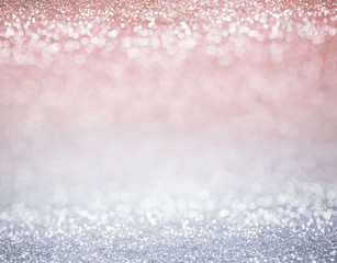glitter pastel colors lights background. light silver, and pink. defocused.