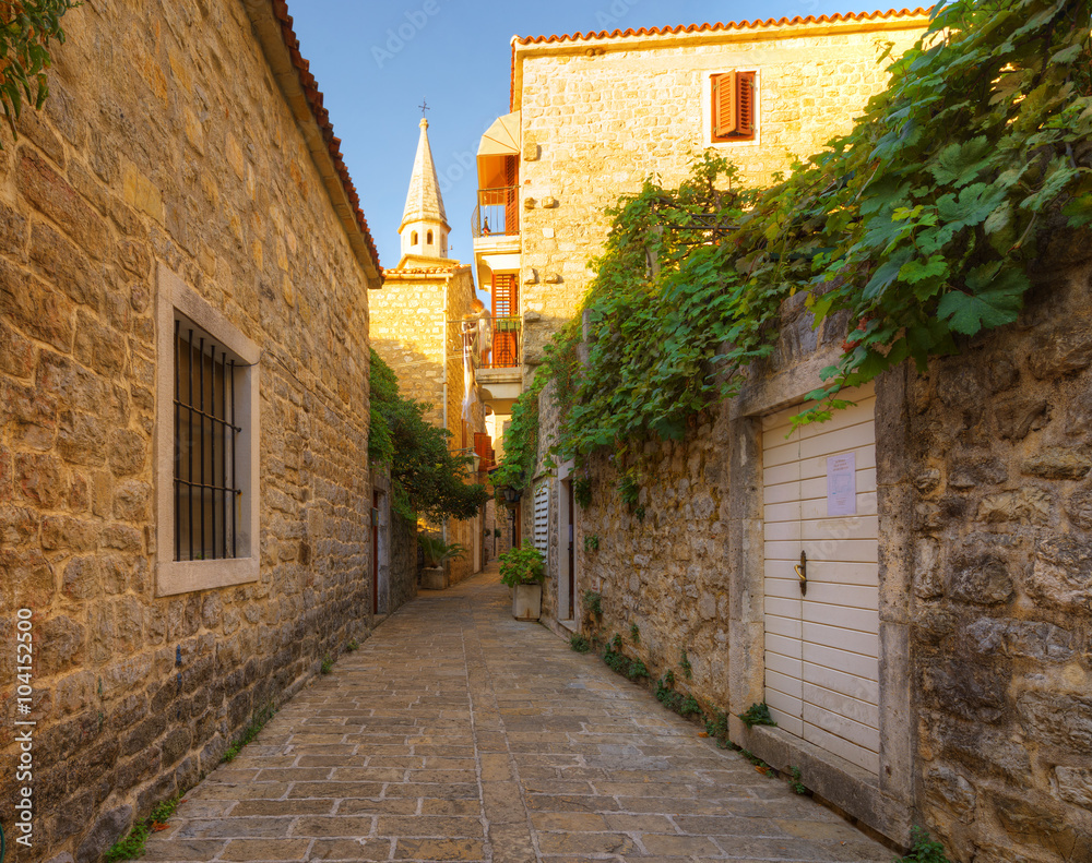view narrow street in old district of Budva, Montenegro