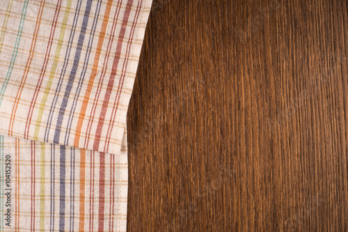 the checkered tablecloth on wooden table