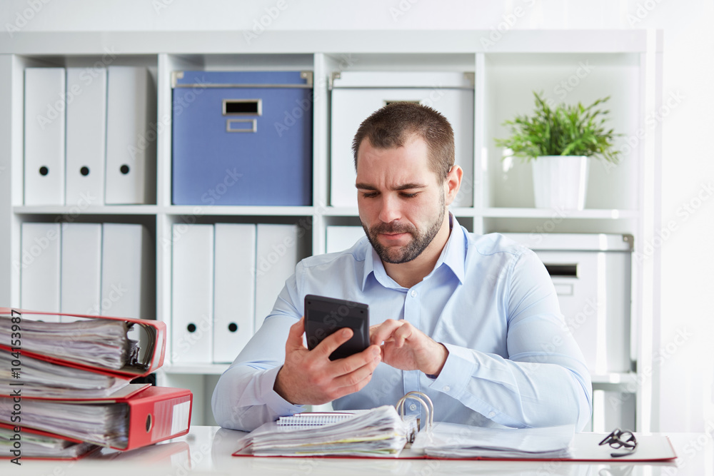 Man calculates taxes Man calculates taxes
