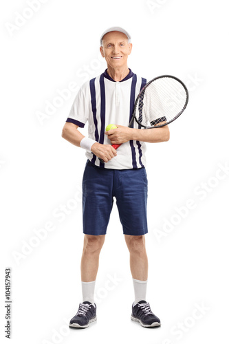 Senior man holding a tennis racket and a ball © Ljupco Smokovski