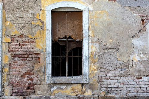 old brick wall with broken window © sachhk