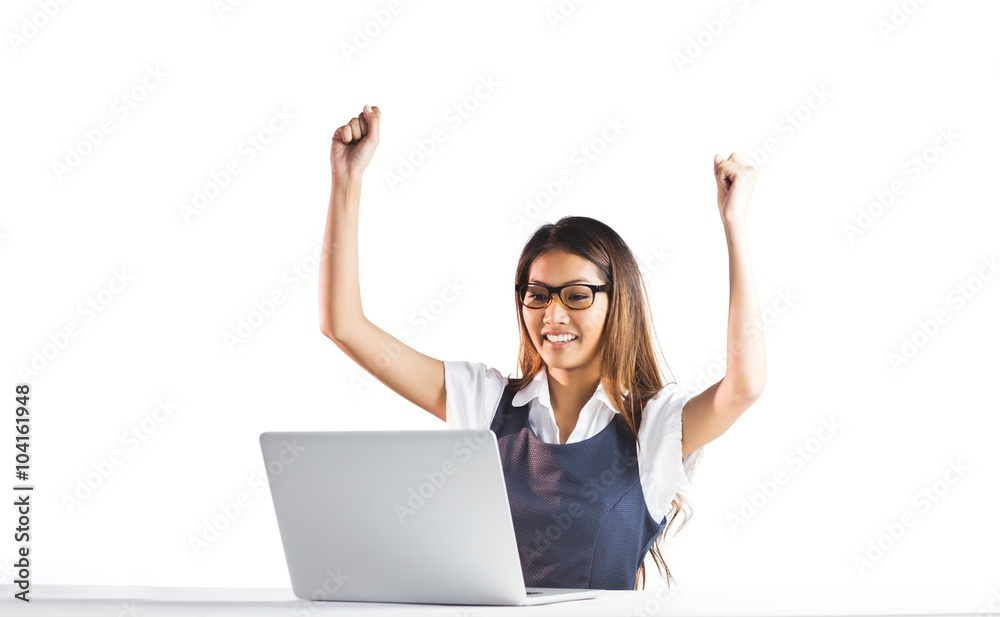 Happy businesswoman using laptop and raising arms Happy businesswoman using laptop and raising arms