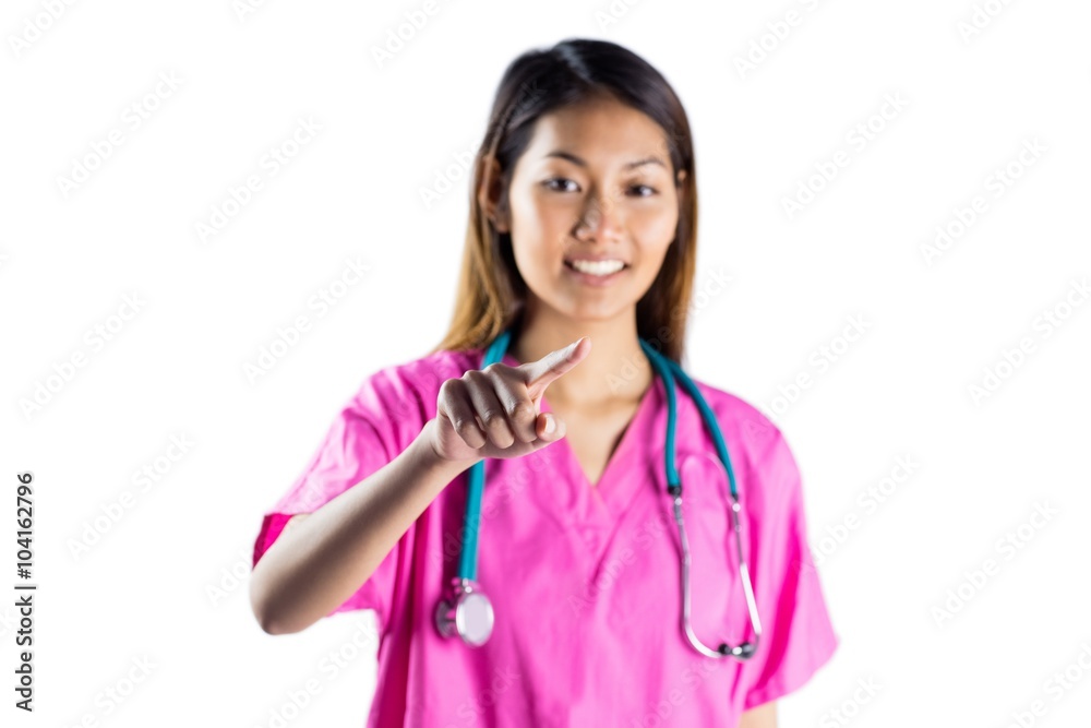 Asian nurse with stethoscope pointing in front of her Asian nurse with stethoscope pointing in front of her