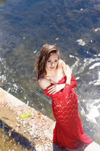 Vogue beautiful sensual girl in the red dress near water © hermanshoroh