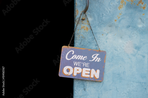 Vintage open sign on metal door