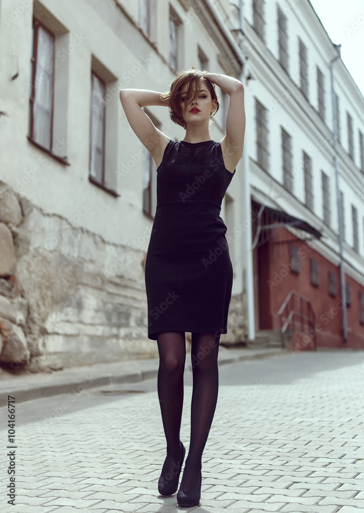 Vogue model in the black dress outdoor portrait