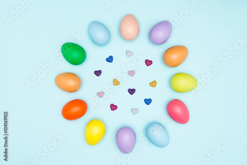 Colorful easter eggs on pastel background