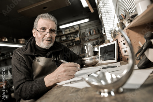 Master goldsmith working with silver-Creative drawing of a silve