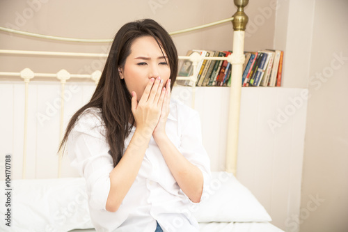 woman drowsiness on bed