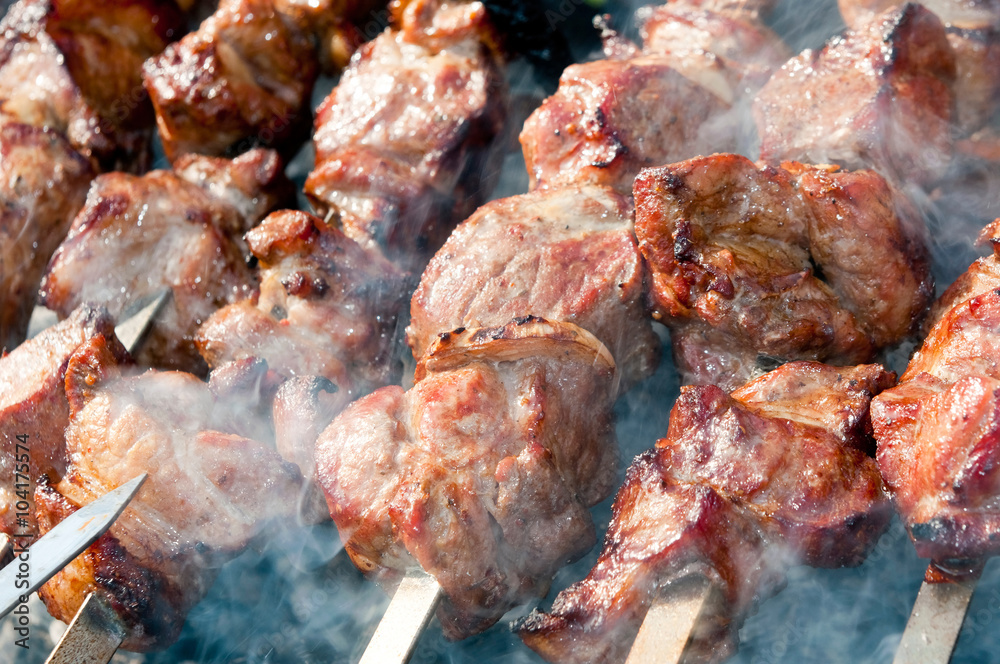 Brazier with the preparing shish kebab on skewers Brazier with the preparing shish kebab on skewers