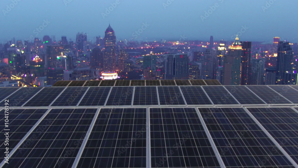 Solar farm with twilight city time lapse
