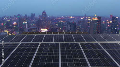 Solar farm with twilight city time lapse