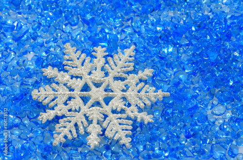 Snowflake on blue glass beads