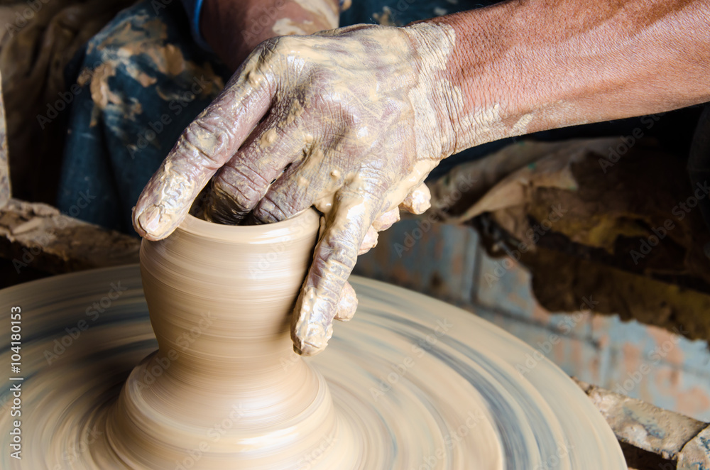 Hands of making clay pot on the pottery wheel ,select focus, close-up. Hands of making clay pot on the pottery wheel ,select focus, close-up.