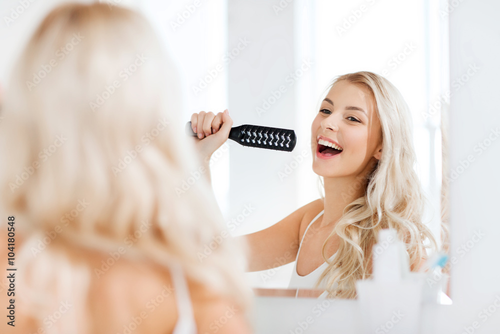 © Syda Productions - happy woman singing to hair brush at bathroom © Syda Productions - happy woman singing to hair brush at bathroom