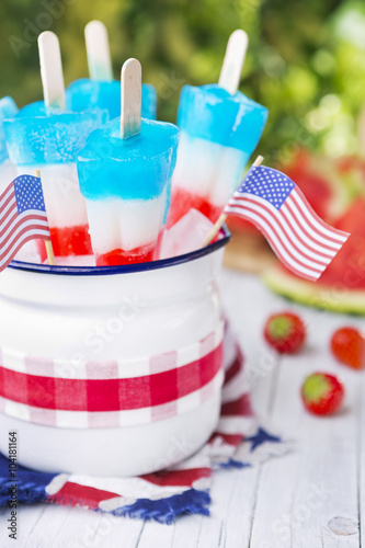 Red-white-and-blue popsicles on an outdoor table