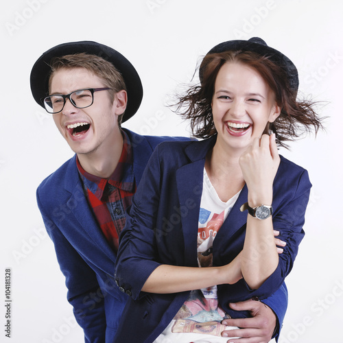 Happy smiling hipster students in the studio