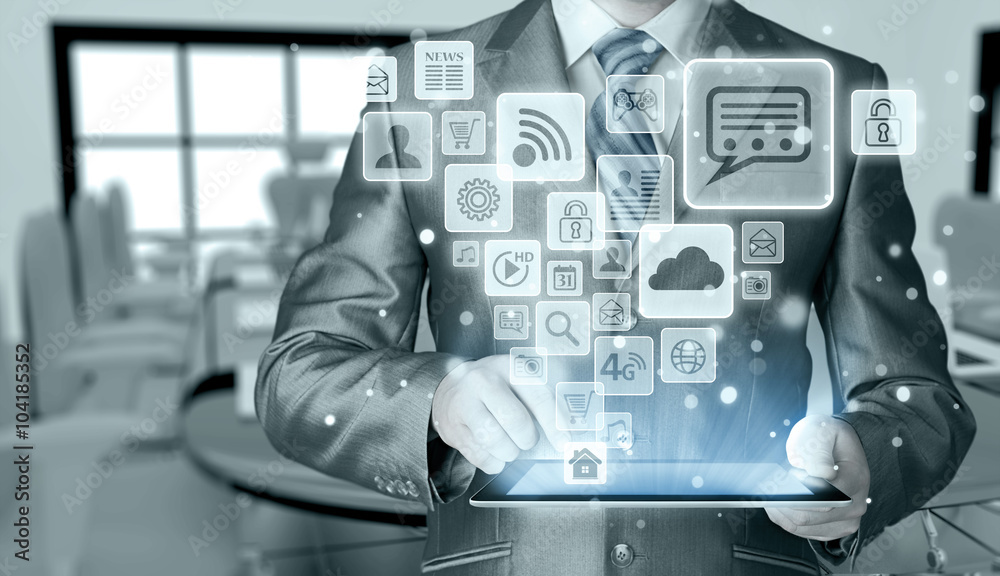 Business man using tablet PC with social media icon set Business man using tablet PC with social media icon set
