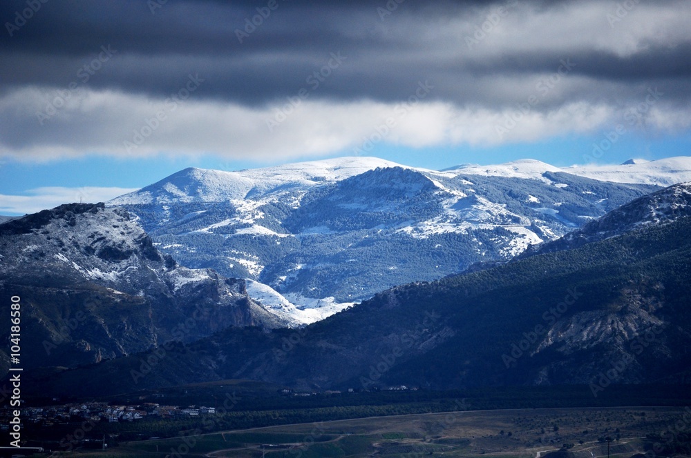 snowy mountains , peaks and clouds