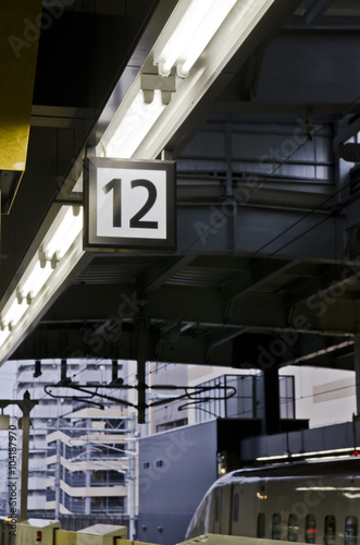 Twelve number label on the train station platform.