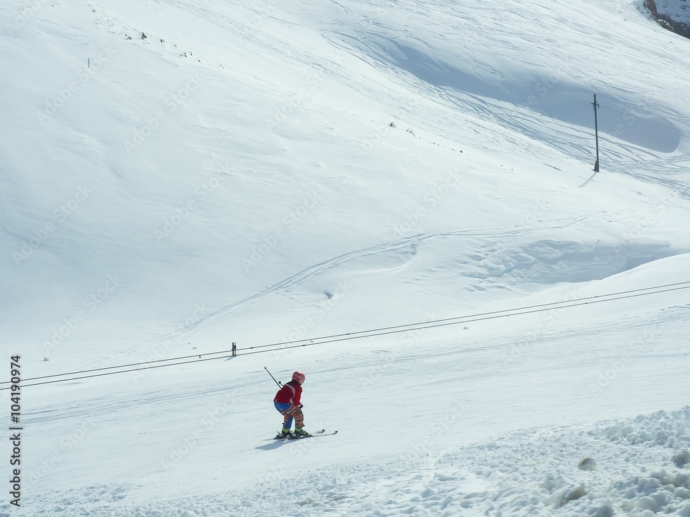 Isolated Skier Skiing On Snow Mountain
