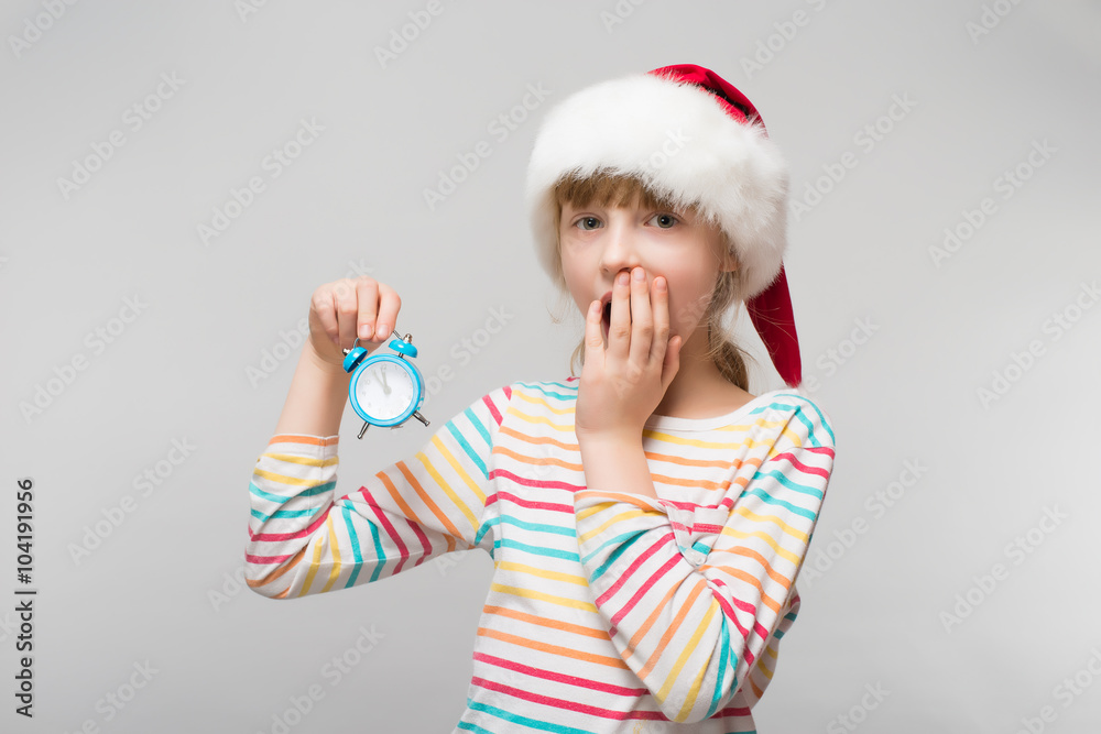 Little girl with a clock