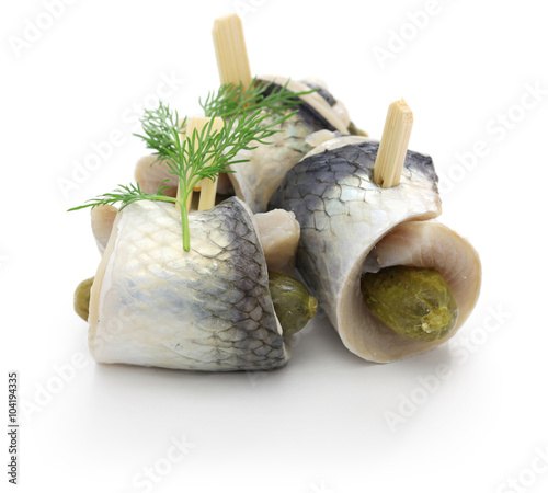 Valokuva homemade rollmops, rolled pickled herring fillets