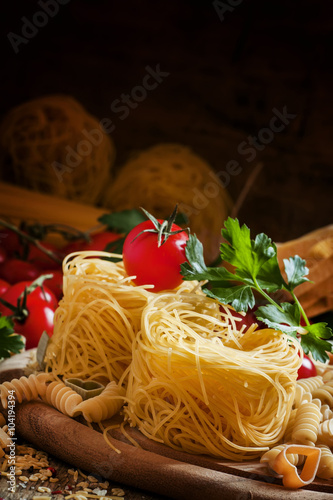 Dry Italian pasta Barbine in nests with cherry tomatoes and pars
