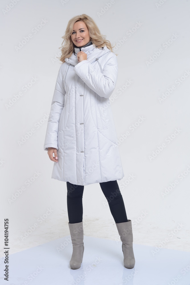 Young woman posing in white coat Young woman posing in white coat
