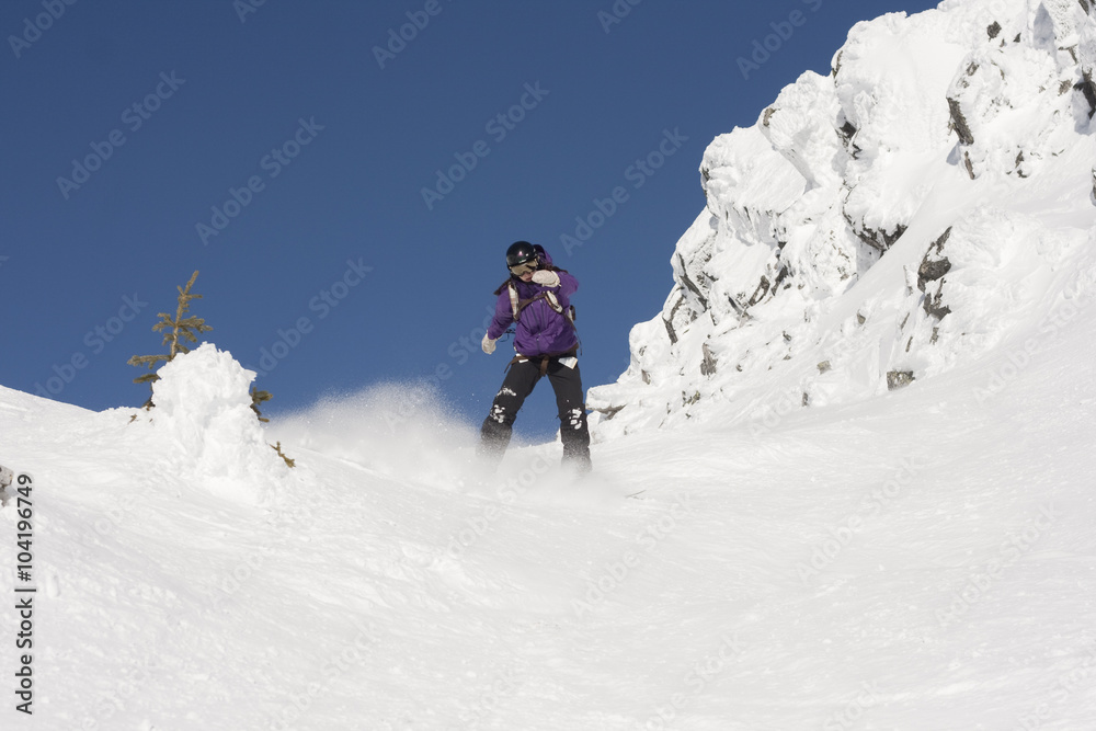 snowboarder in mountain terrain