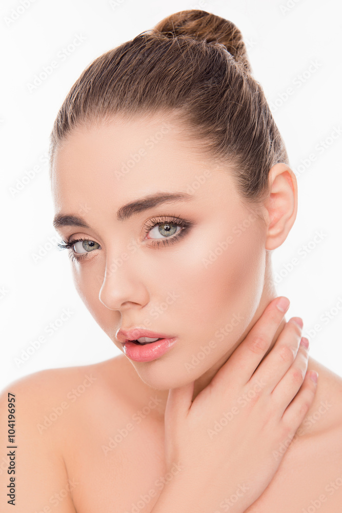 Close up photo of cute young relaxed girl touching her neck Close up photo of cute young relaxed girl touching her neck