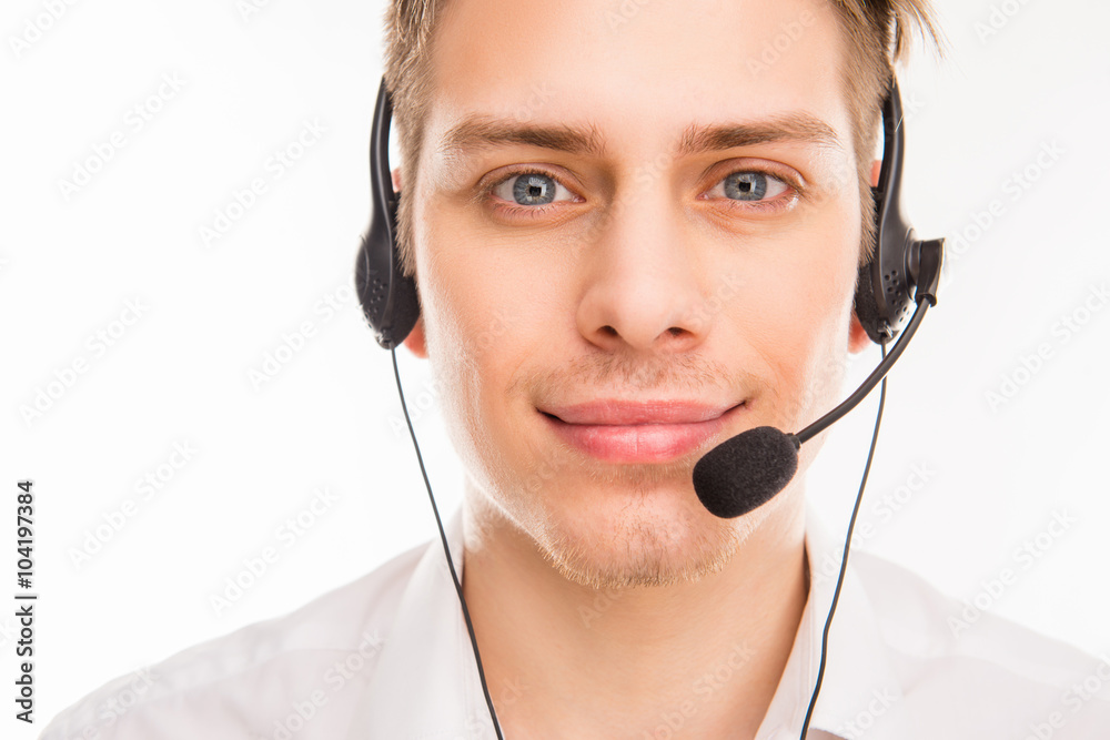 A close-up photo of smiling young agent of call centre A close-up photo of smiling young agent of call centre