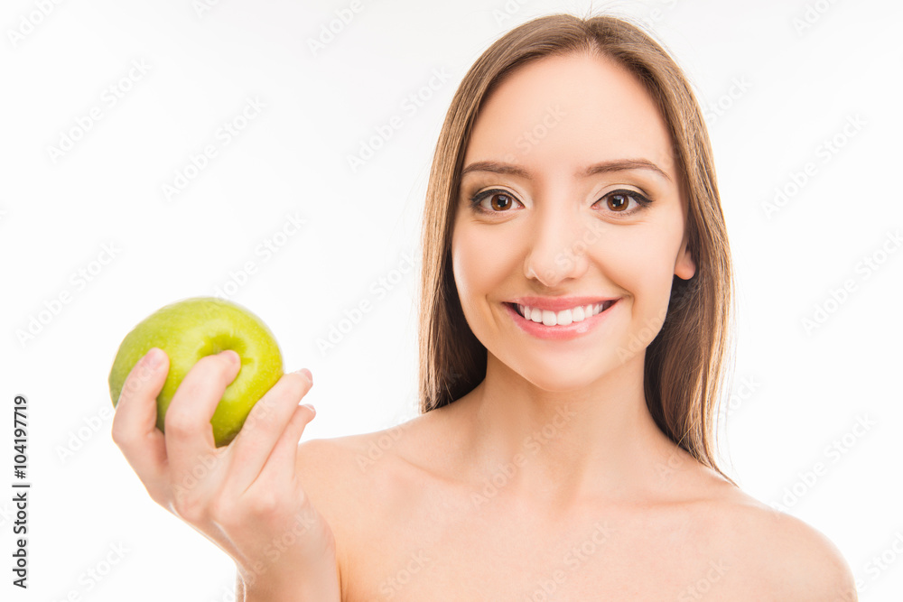 Beautiful healthy toothy girl smiling with green apple Beautiful healthy toothy girl smiling with green apple
