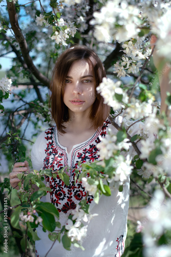 Young beautiful woman near the apple tree Young beautiful woman near the apple tree