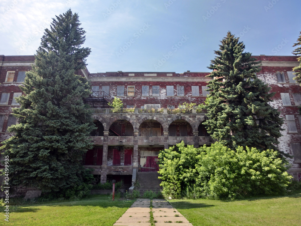 Fototapeta premium Large abandoned school exterior - landscape color photo