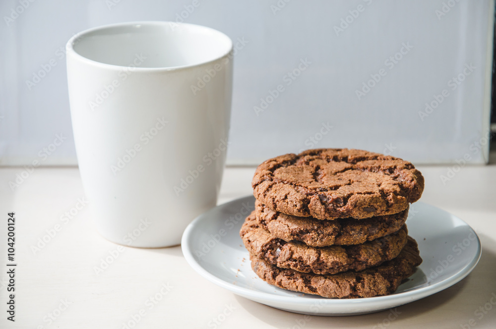 A cup and some biscuits A cup and some biscuits