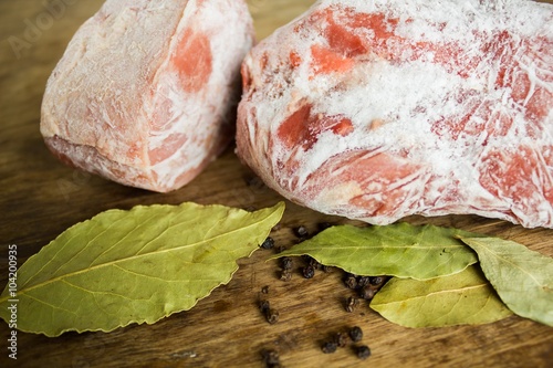Frozen meat on a wooden table