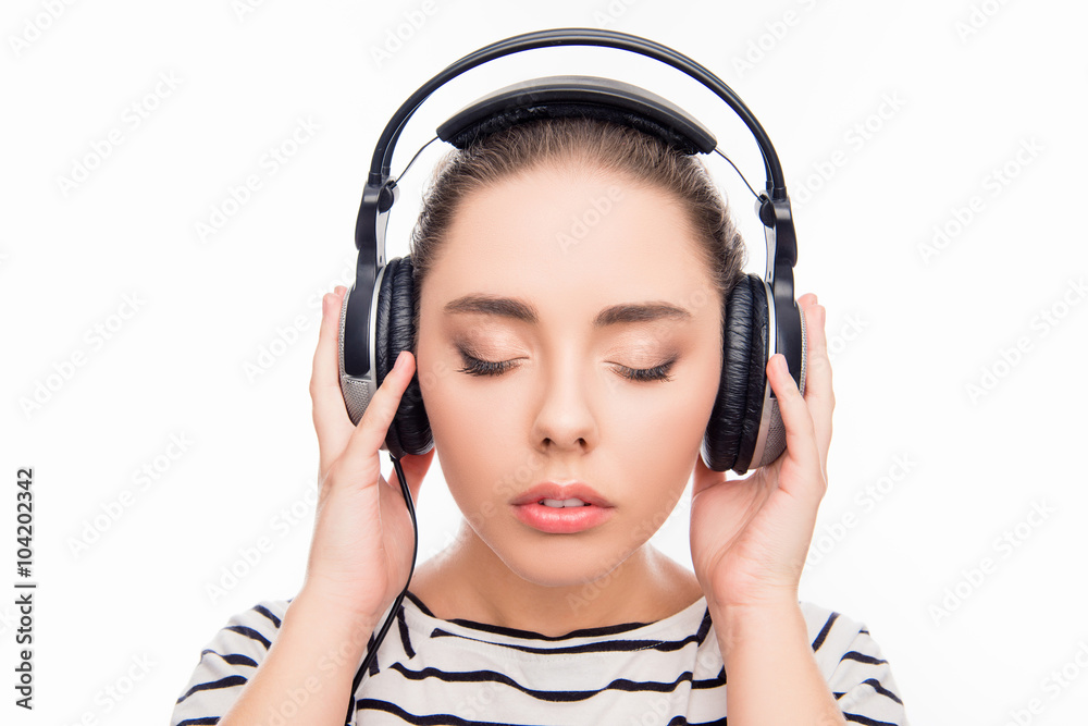 Calm relaxed young woman with headphones and closed eyes Calm relaxed young woman with headphones and closed eyes