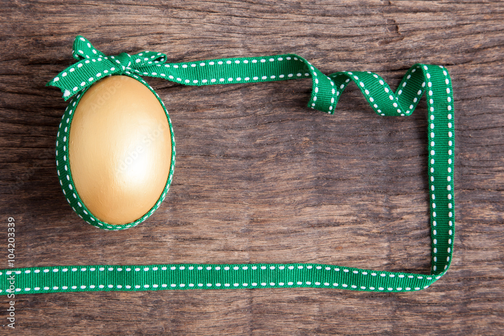 golden easter egg with ribbon golden easter egg with ribbon