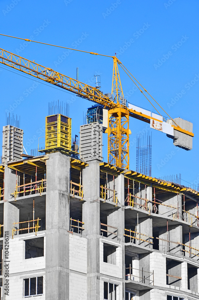 Concrete formwork and crane on construction site