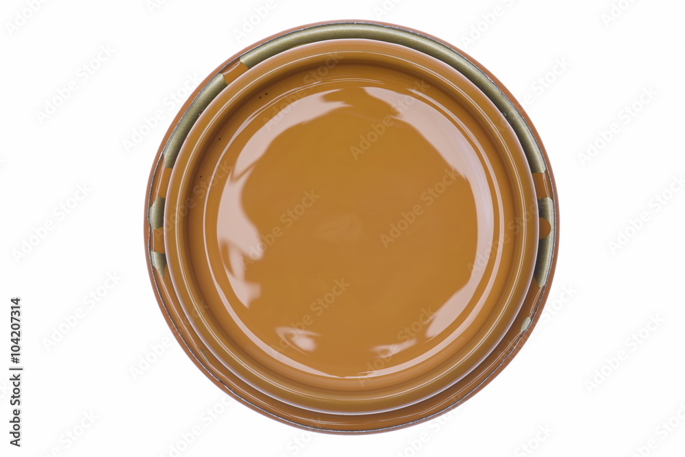 Can lid with brown paint isolated on white background, top view Can lid with brown paint isolated on white background, top view