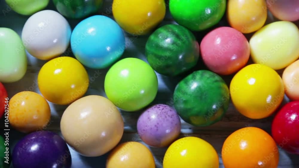 Multi-colored sweets, lollipops and chewing gum. dolly shot Multi-colored sweets, lollipops and chewing gum. dolly shot