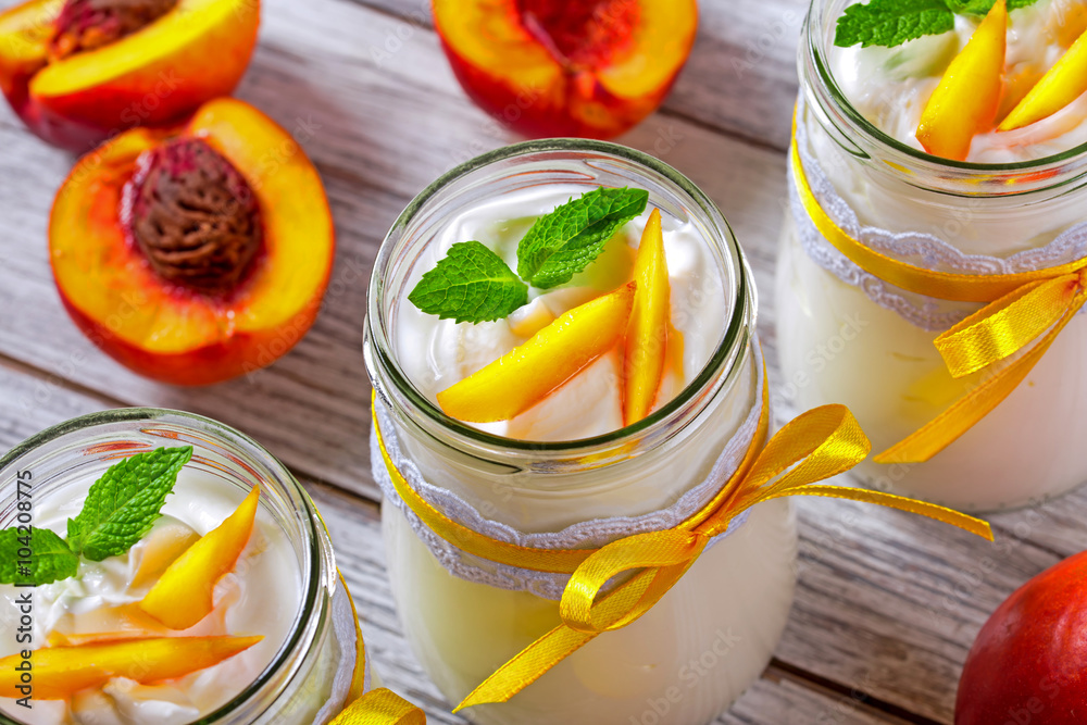 yogurt with a peaches, side view yogurt with a peaches, side view
