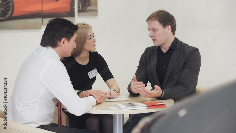 Business woman and businessman communicate with the client. Business woman and businessman communicate with the client.