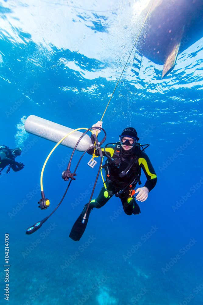 Diver with additional tank Diver with additional tank