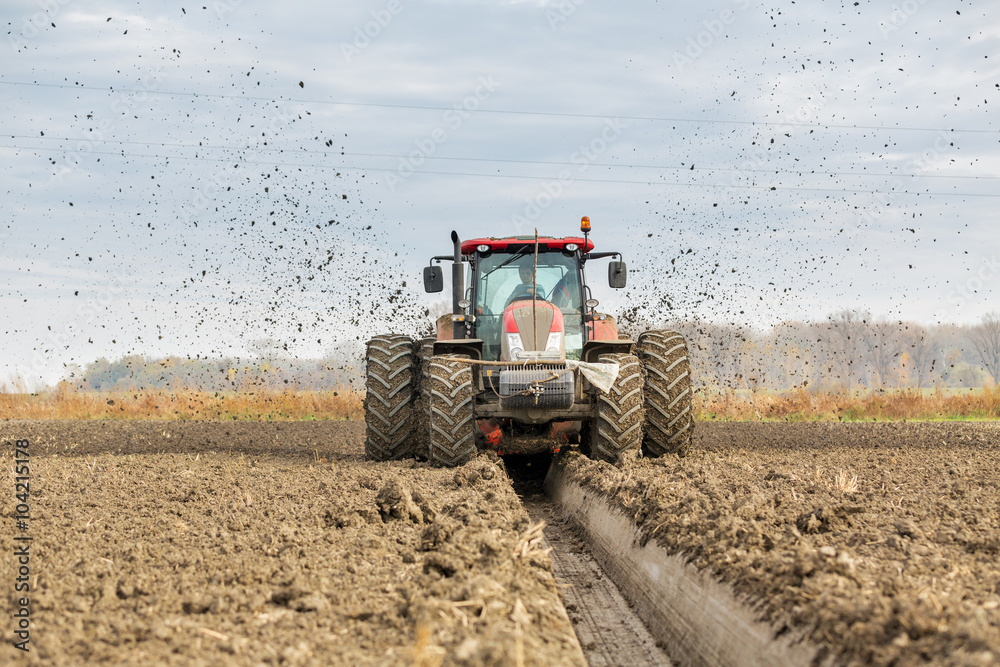 Tractor with double wheeled ditcher digging drainage canal Stock Photo ...