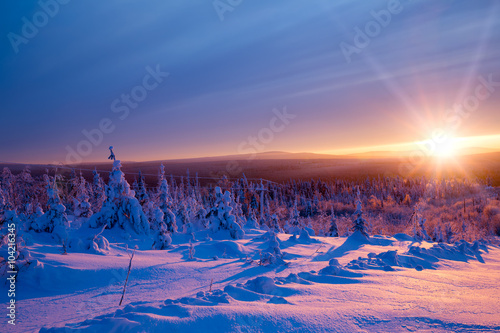 Beautiful scarlet sunset in the winter mountains