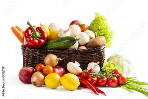 basket with fruits vegetables on a white background